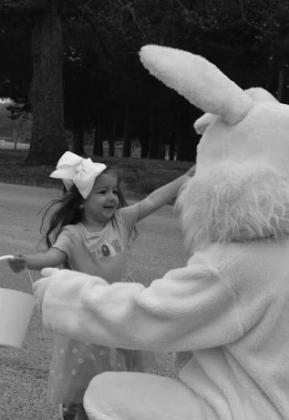 Willow McDaniel runs to hug the bunny.